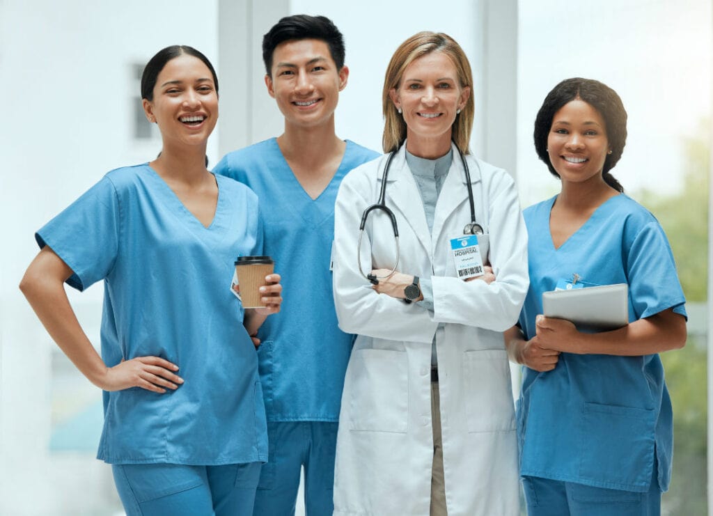 Nurses together in a hospital smiling